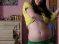 Youthful teen bedroom strip, yellow top and little green pants cast aside showing her little tits and pussy.