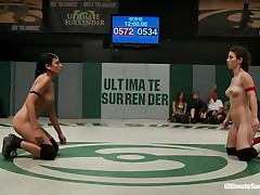 The match is intensive and it appears to be that the referee is looking somewhere else because things are going wild in the arena. These bitches don't know the meaning of fair play and a cutie comes in the aid of the other one. Looks like someone will need to surrender