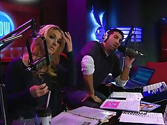 The hosts of Playboy Radio's Morning Show are looking at their guest model who is wearing the suit she'll be wearing to the Playboy Mansion for Halloween. Her head and tits are overspread in fake fruit like oranges, limes, lemons, and more. She flashes her breasts for the hosts and viewers.